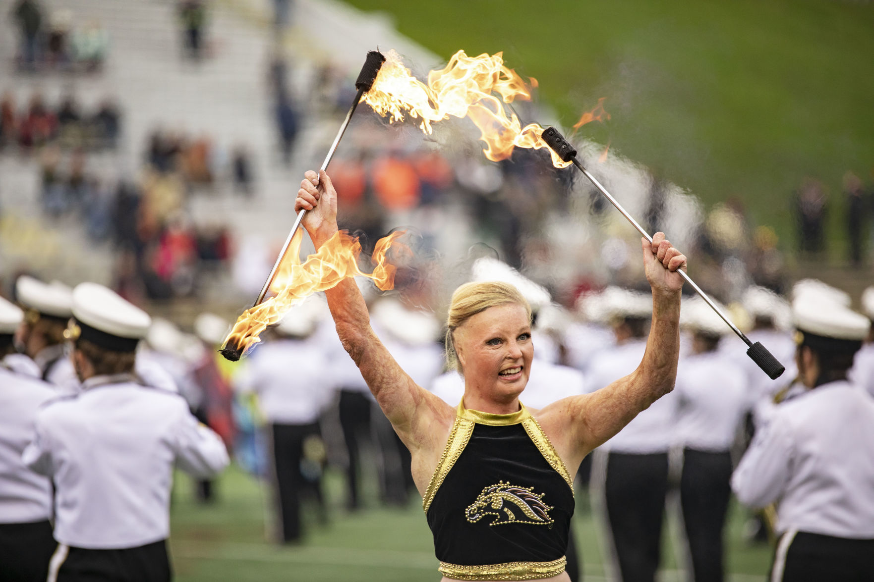 WMU twirler performs with fire at halftime